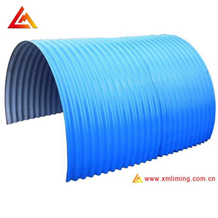 Curved corrugated metal roof panel for building enclosure